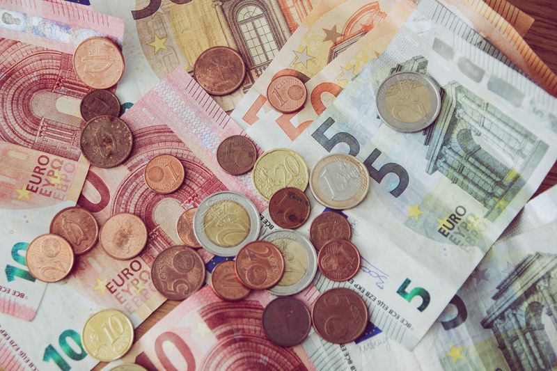 Messy pile or euro currency; notes and coins