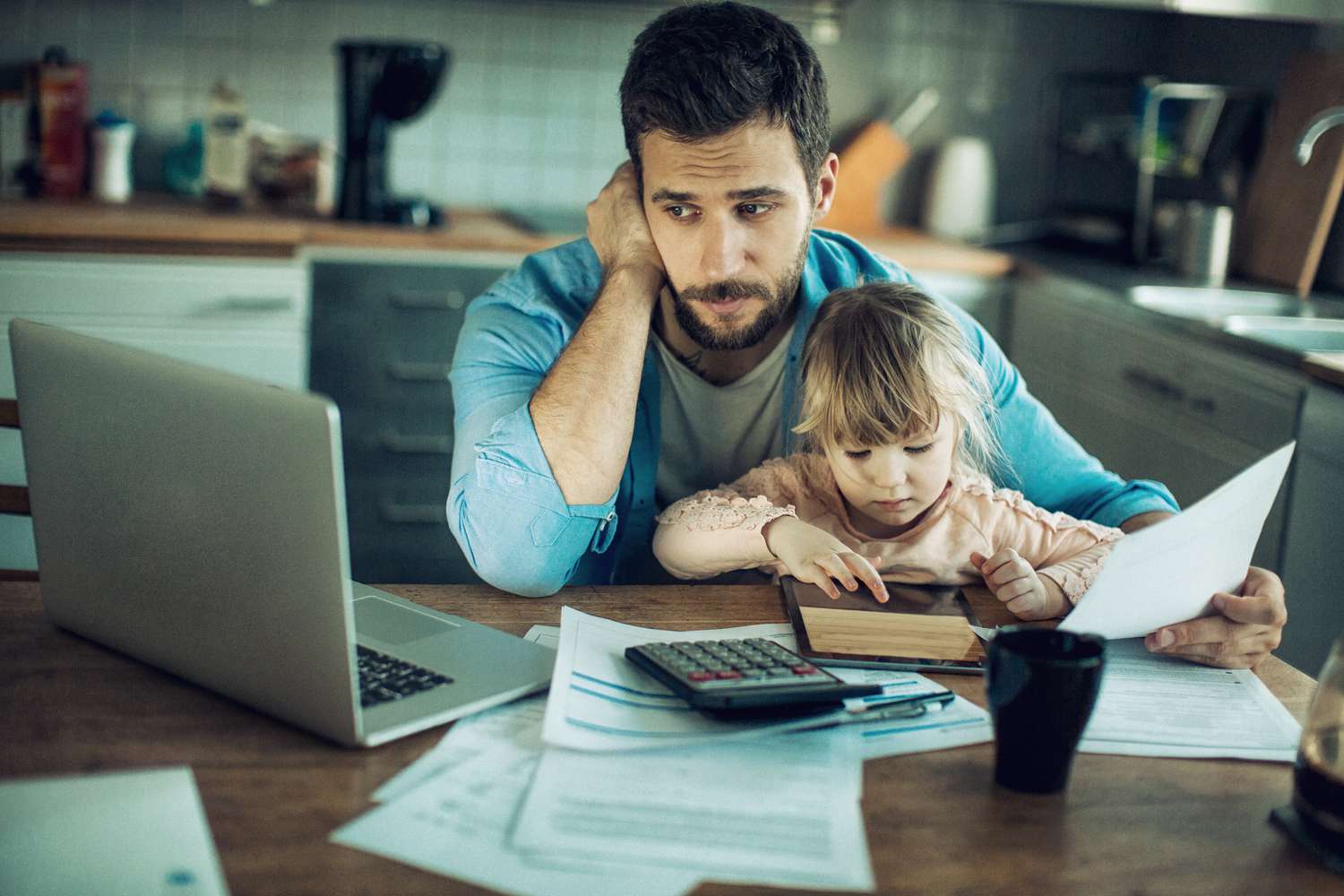 Close up of a father and daughter in their kitchen