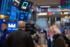 Traders work on the New York Stock Exchange (NYSE) floor 