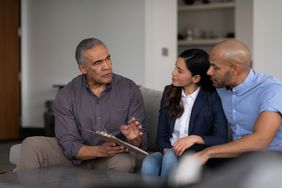 Couple discussing with financial advisor about private mortgage insurance (PMI)