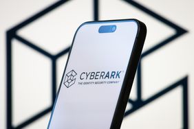 Smartphone screen displaying 'CyberArk, The Identity Security Company' logo, with a geometric design in the background