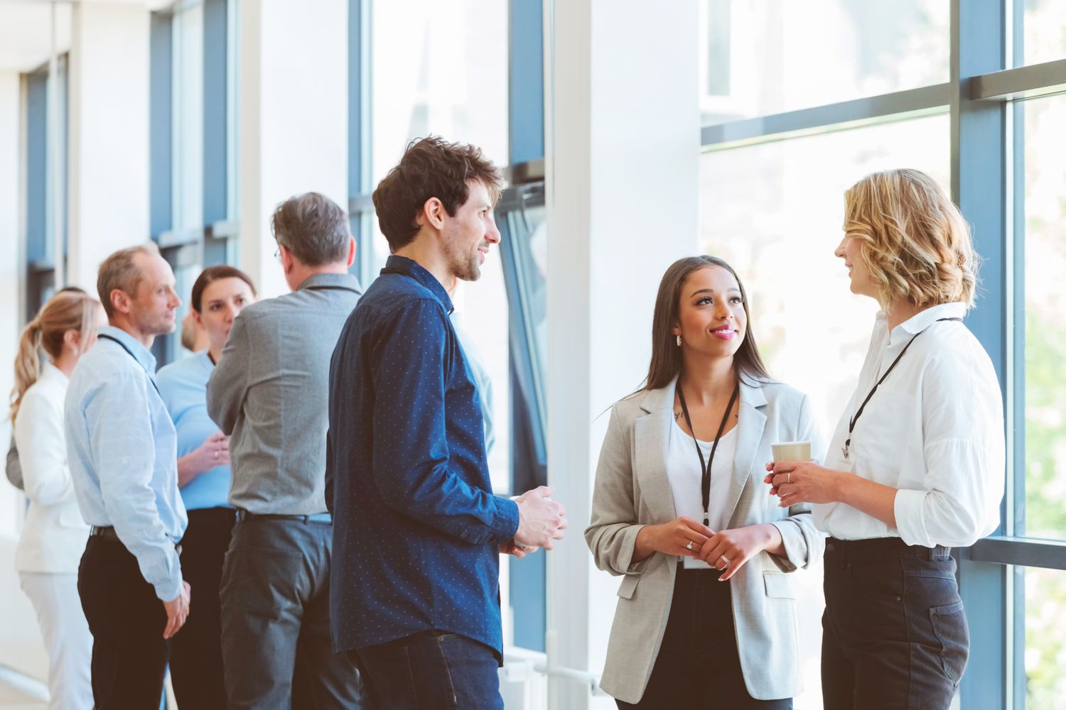 Group of finanial advisors at a conference during a coffee break.
