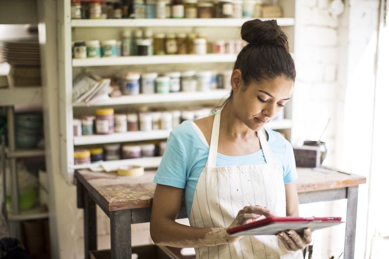 Female potter working in her studio