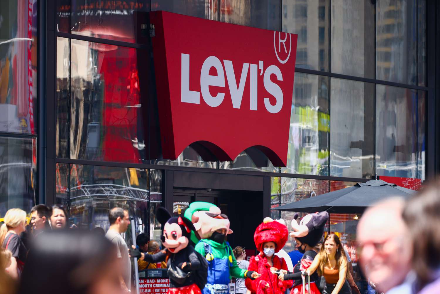 The Levi's logo is visible on the side of a building in Times Square.