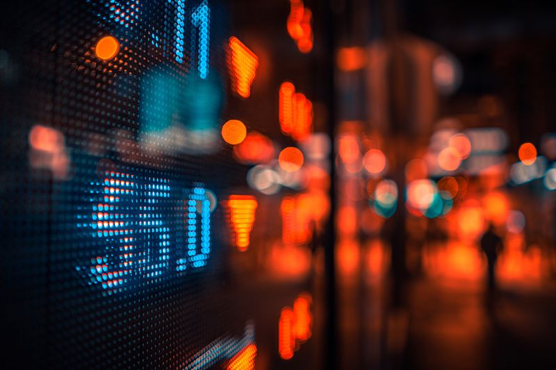 Financial stock market numbers and city lights