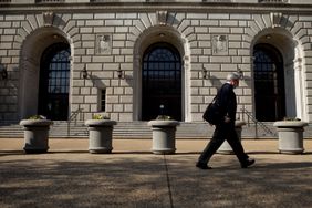 Man walks past the IRS building in Washington D.C.