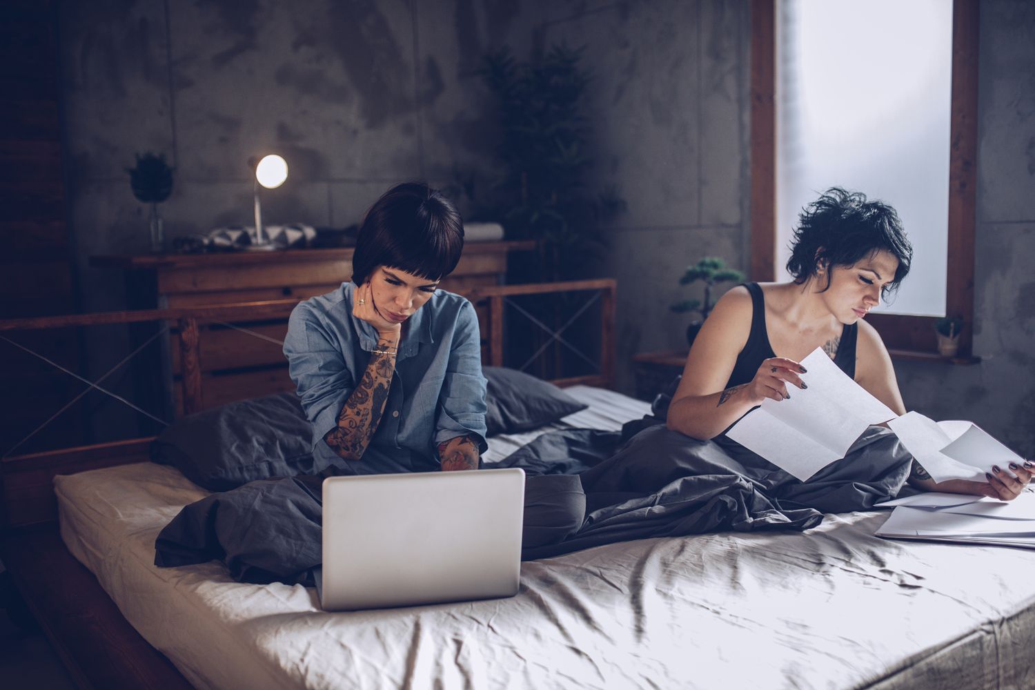 Couple looks over their credit after getting a personal loan