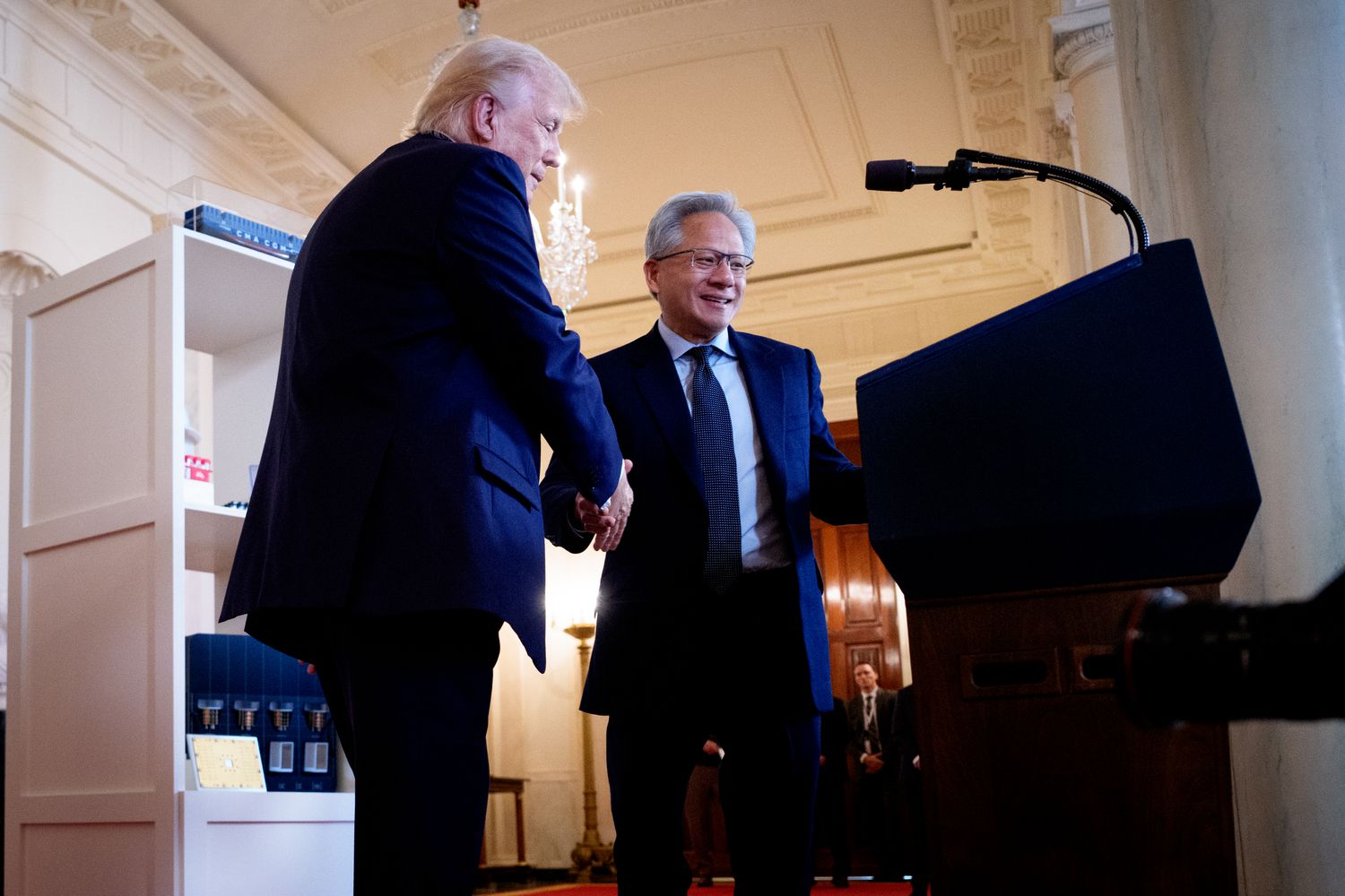 U.S. President Donald Trump (L) invites Nvidia CEO Jensen Huang to speak in the Cross Hall of the White House during an event on "Investing in America" on April 30, 2025 in Washington, DC. 