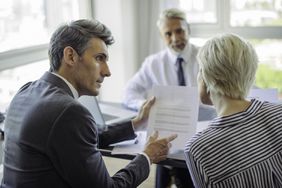 Businessman Meeting With Couple
