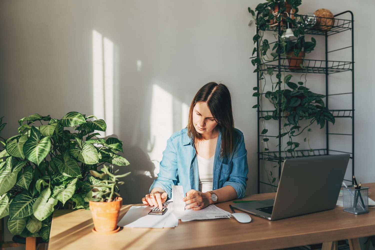 A woman calculating bills