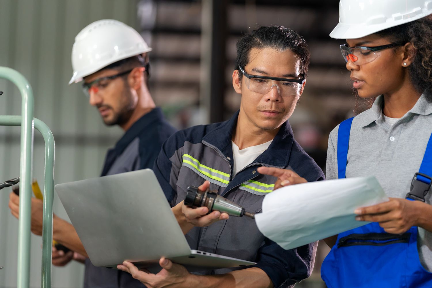 Diverse group of engineers working together in a factory