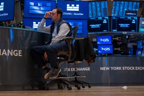 Traders work on the floor of the New York Stock Exchange.
