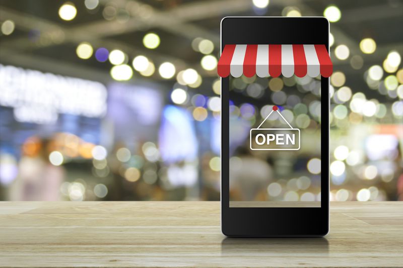 Modern smart mobile phone with on line shopping store graphic