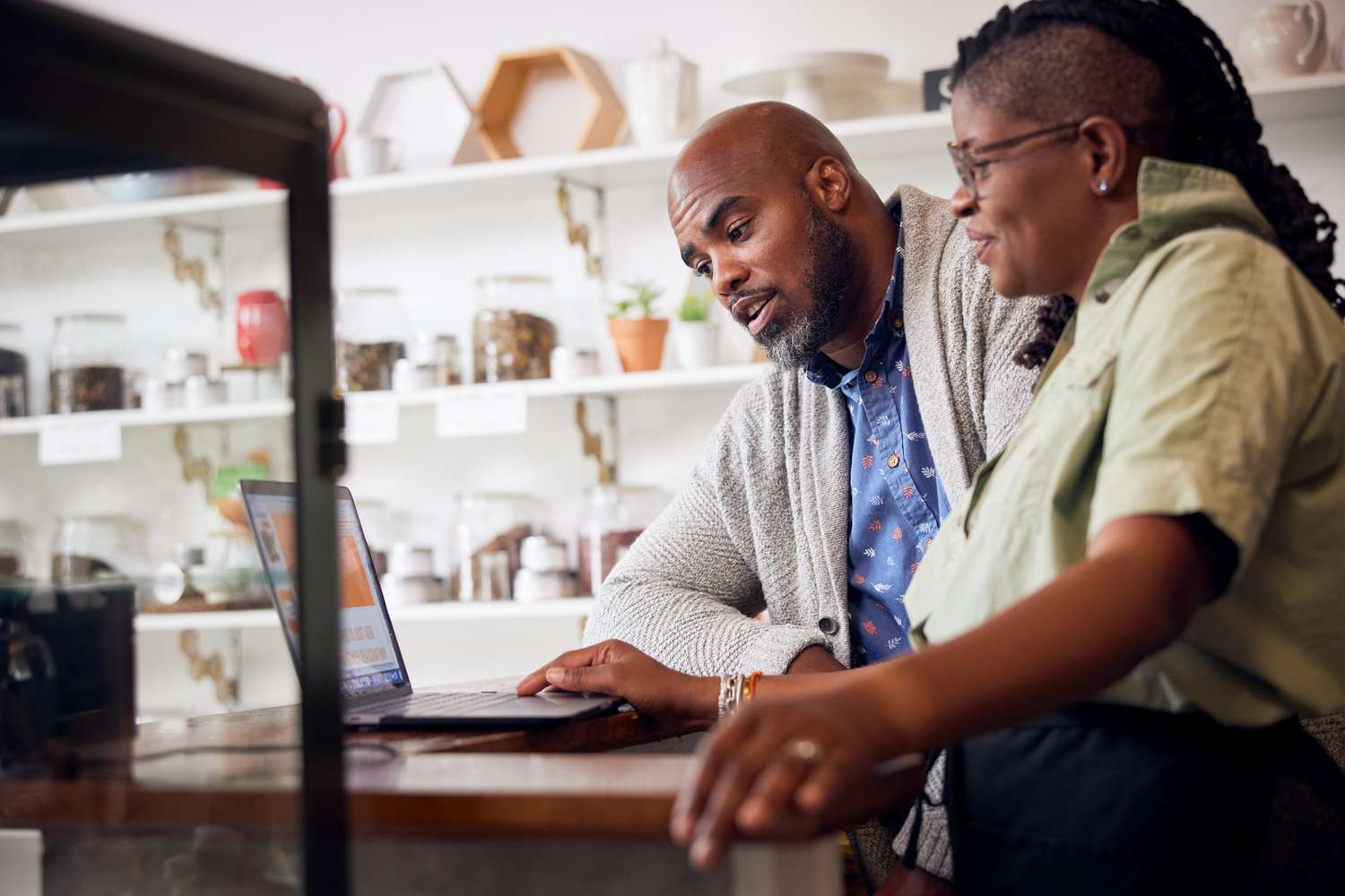 A couple of business owners looking into opening a business checking account.