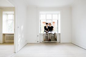 Couple sitting in window of new home
