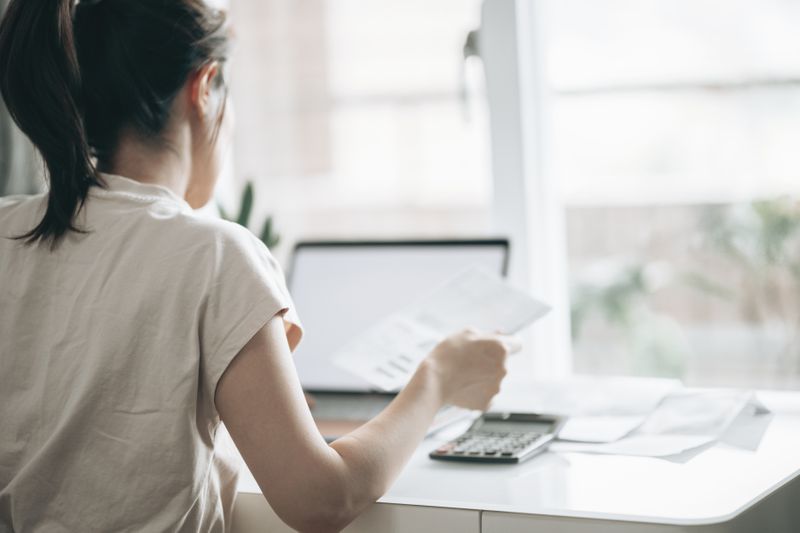 Woman doing taxes at a desk