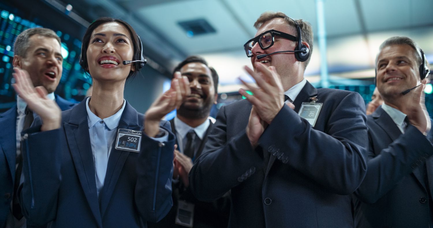 Group of Successful Stock Exchange Brokers Celebrating a Profitable Investment Bid on a Securities Market.
