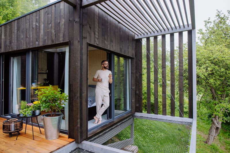 Man inside of tiny home