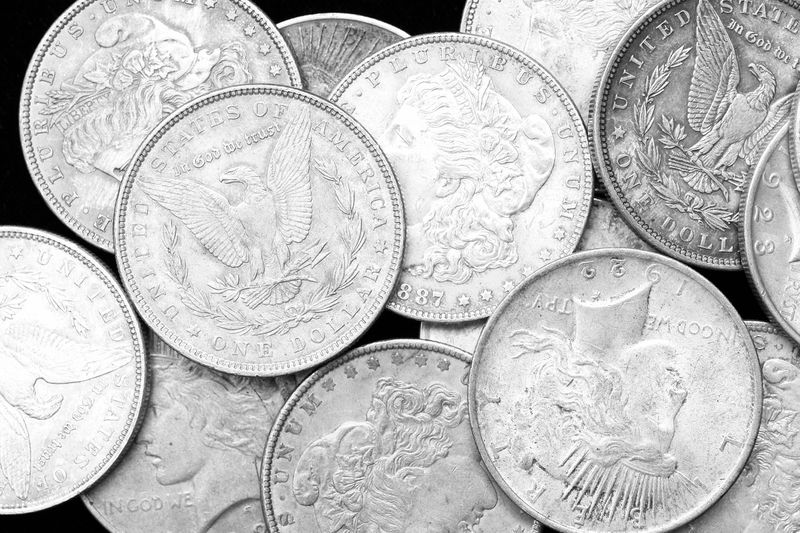 A pile of US silver dollars