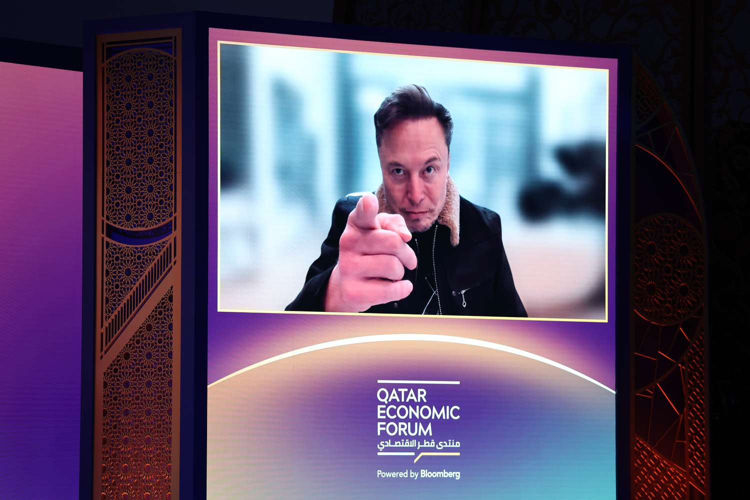 Tesla CEO Elon Musk on screen at the Qatar Economic Forum.