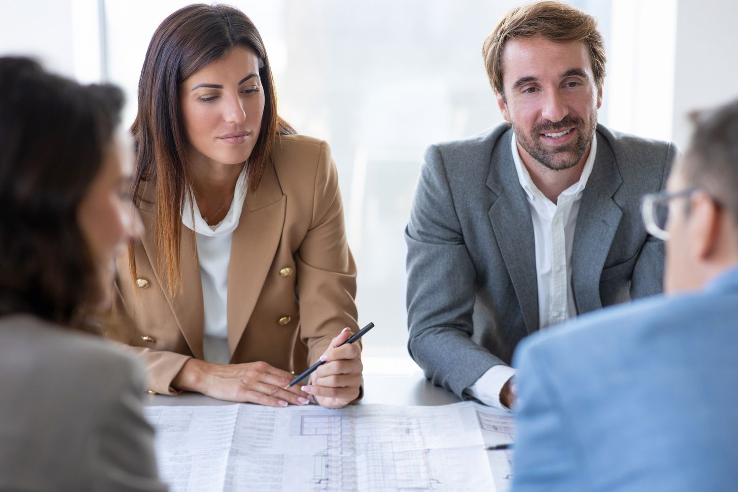Group of investors sitting around a table
