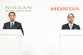 Nissan Motor CEO Makoto Uchida (L) and Honda Motor CEO Toshihiro Mibe (R) attend a joint press conference on December 23, 2024, in Tokyo, Japan