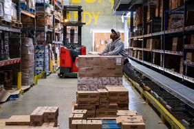 A worker stocks shelves at the George J. Falter Company Inc. warehouse in Baltimore, Maryland, US, on Tuesday, April 9, 2024. 
