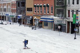 A man uses snow shoes to move through the downtown area near the University of Iowa as a major winter storm moves through the Midwest February 2, 2011 in Iowa City, Iowa.
