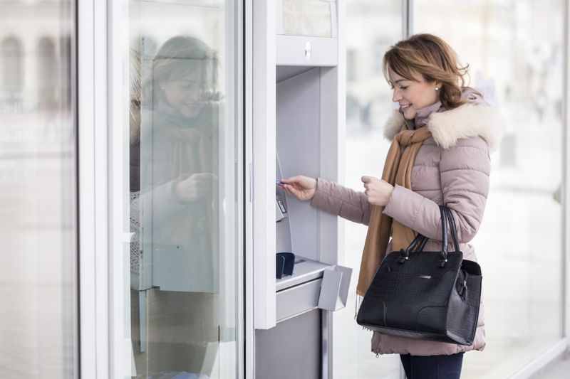 Woman using an ATM