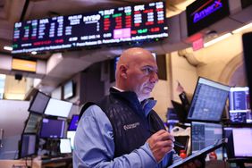 Traders work on the floor of the New York Stock Exchange