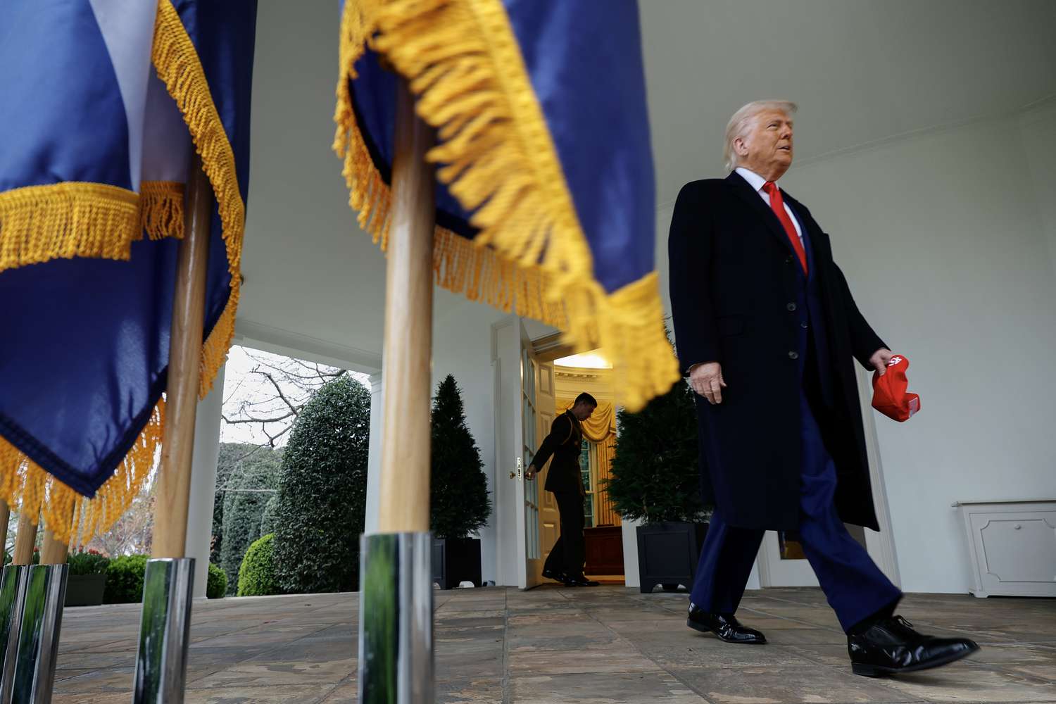 U.S. President Donald Trump walks along the Rose Garden colonade as he arrives for a "Make America Wealthy Again" event in the Rose Garden at the White House on April 2, 2025 in Washington, DC.