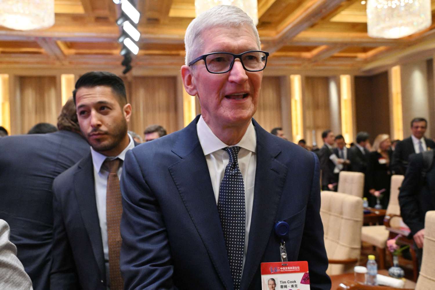 Apple CEO Tim Cook attends the opening ceremony of the China Development Forum at the Diaoyutai State Guesthouse in Beijing on March 23, 2025.