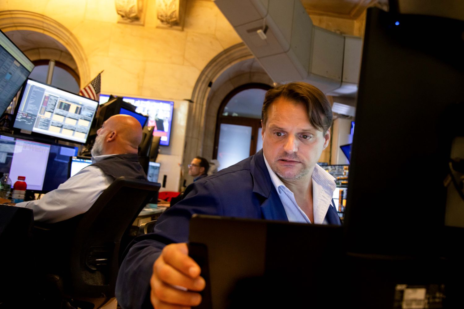 Traders work on the floor of the New York Stock Exchange.