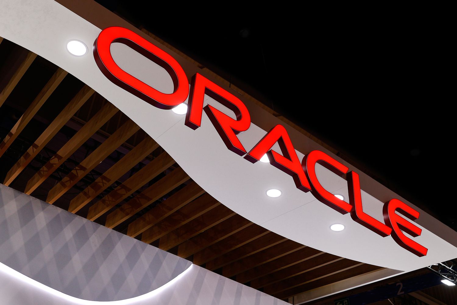 The Oracle logo on display at a conference.