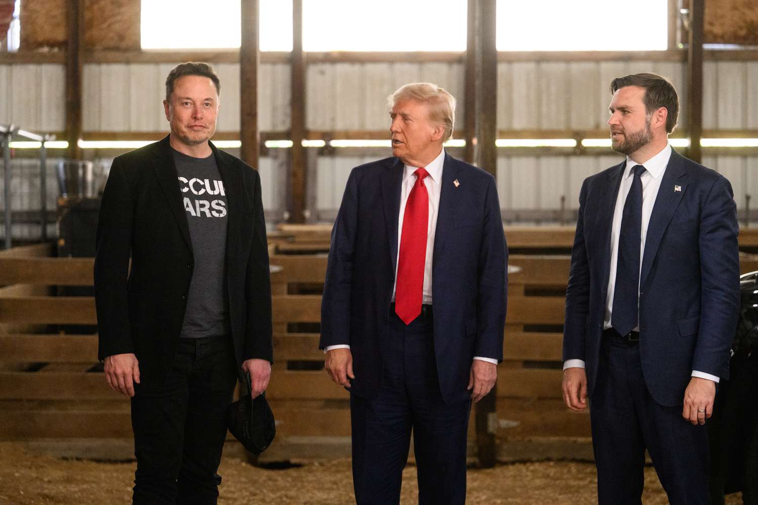 Former US President Donald Trump, center, and Senator JD Vance, right, a Republican from Ohio and Republican vice-presidential nominee, greet Elon Musk, chief executive officer of Tesla Inc., backstage prior to a campaign event at the Butler Farm Show in Butler, Pennsylvania, US, on Saturday, Oct. 5, 2024.