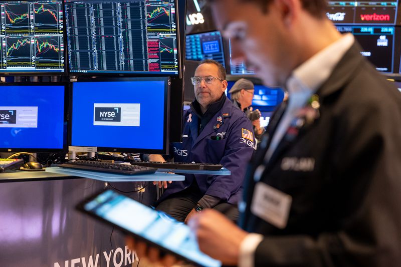Traders work on the floor of the New York Stock Exchange (NYSE) on May 19, 2025 in New York City.