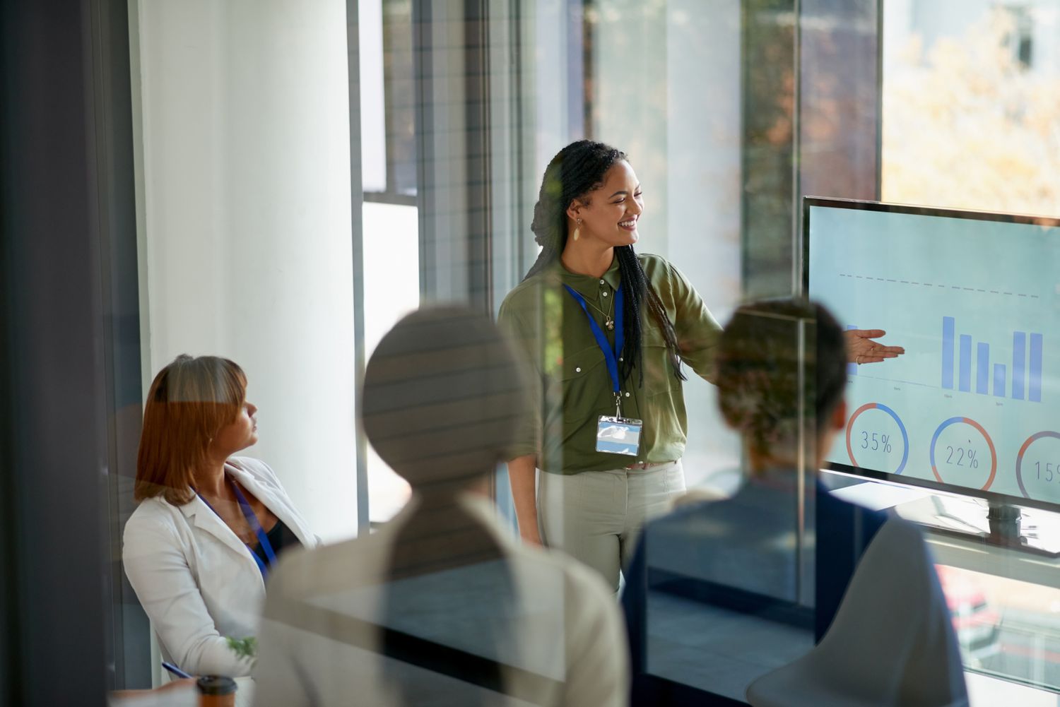 Marketing manager presents analysis charts based on data collected from company's social media.