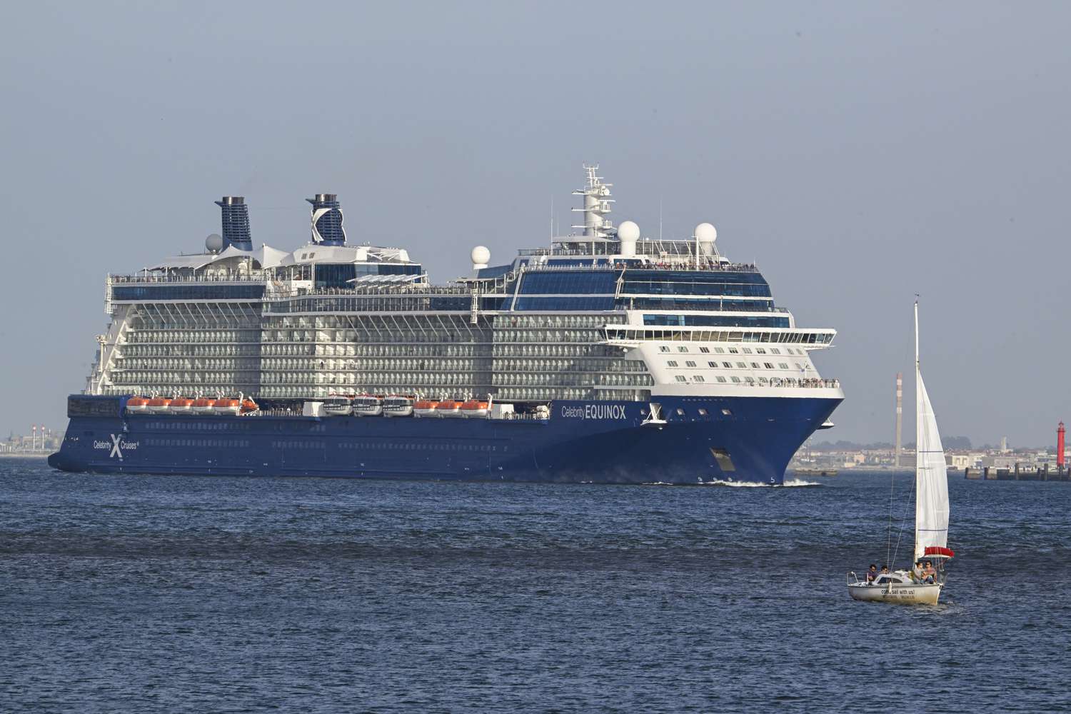 Celebrity Equinox, a 121,878 GT Solstice-class cruise ship owned by Royal Caribbean Cruises Ltd. and operated by Celebrity Cruises, sails the Tagus River after leaving Lisbon cruise terminal on August 31, 2024, in Lisbon, Portugal
