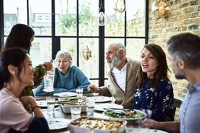 Multi-generational family sitting around a dinner table