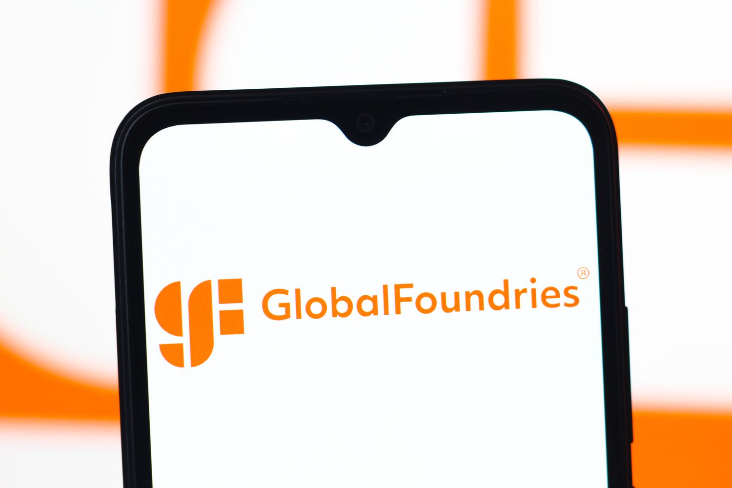The GlobalFoundries logo is seen displayed on a smartphone screen