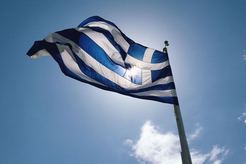 View Of Flag Against Blue Sky