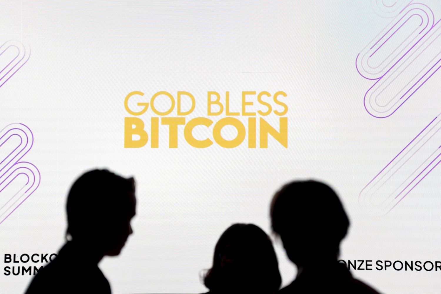 "God Bless Bitcoin" signage during the DC Blockchain Summit in Washington, DC.
