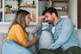 Worried couple on a couch