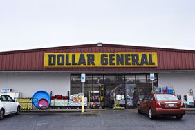 A costumer leaves Dollar General. 