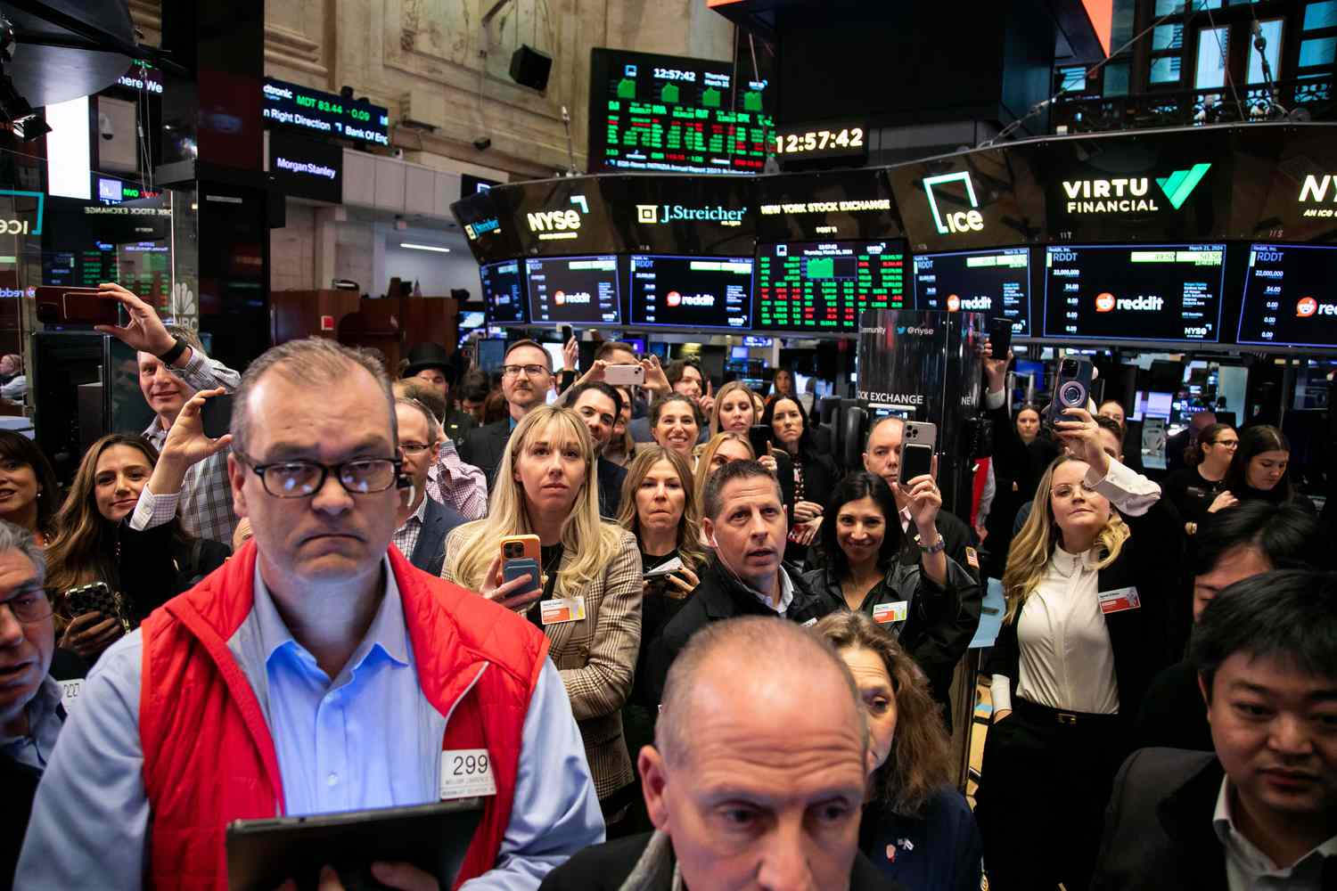 Traders work during the Reddit Inc. initial public offering (IPO) on the floor of the New York Stock Exchange.