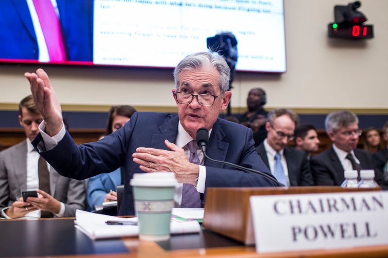 Federal Reserve Chairman Jerome Powell talking and using his hands.