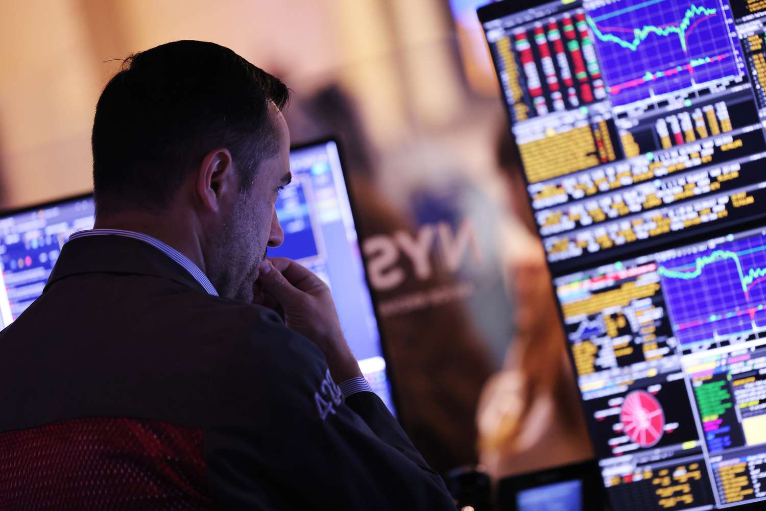 Traders work on the floor of the New York Stock Exchange.