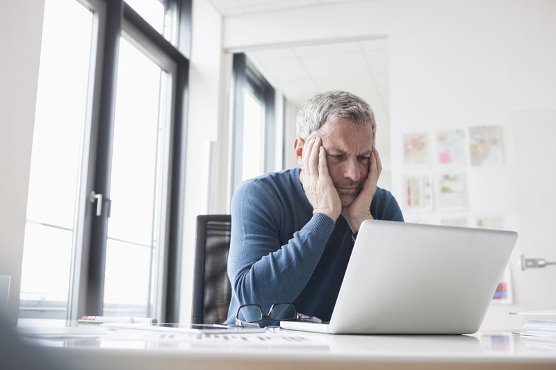 Man at Desk, Looking Stressed