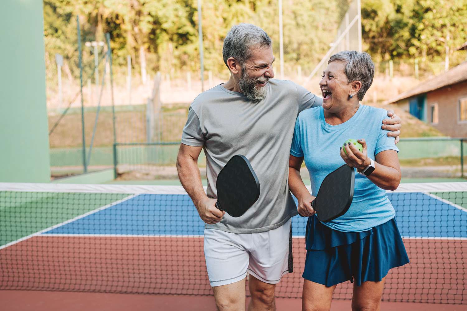 Couple playing pickleball 