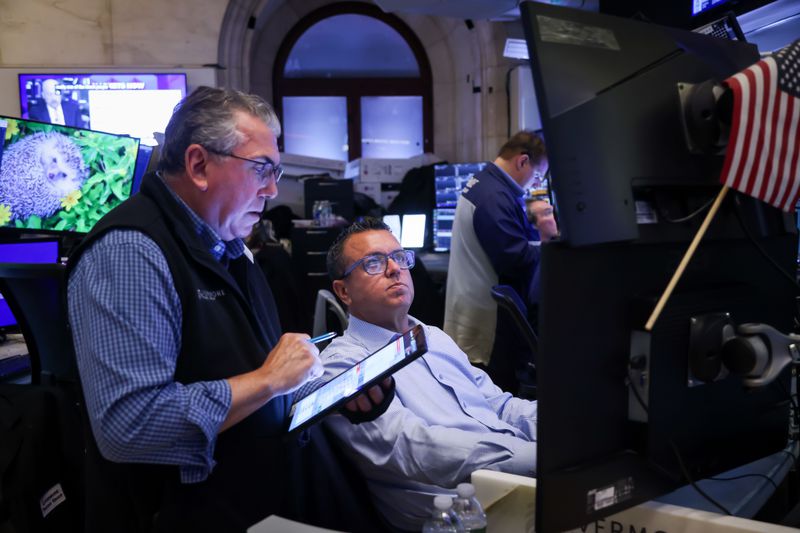 Traders work on the floor at the New York Stock Exchange (NYSE) in New York, US, on Thursday, May 15, 2025.